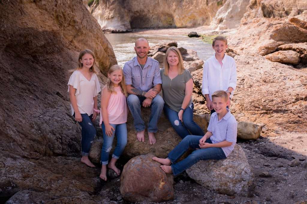family with kids photos on the beach